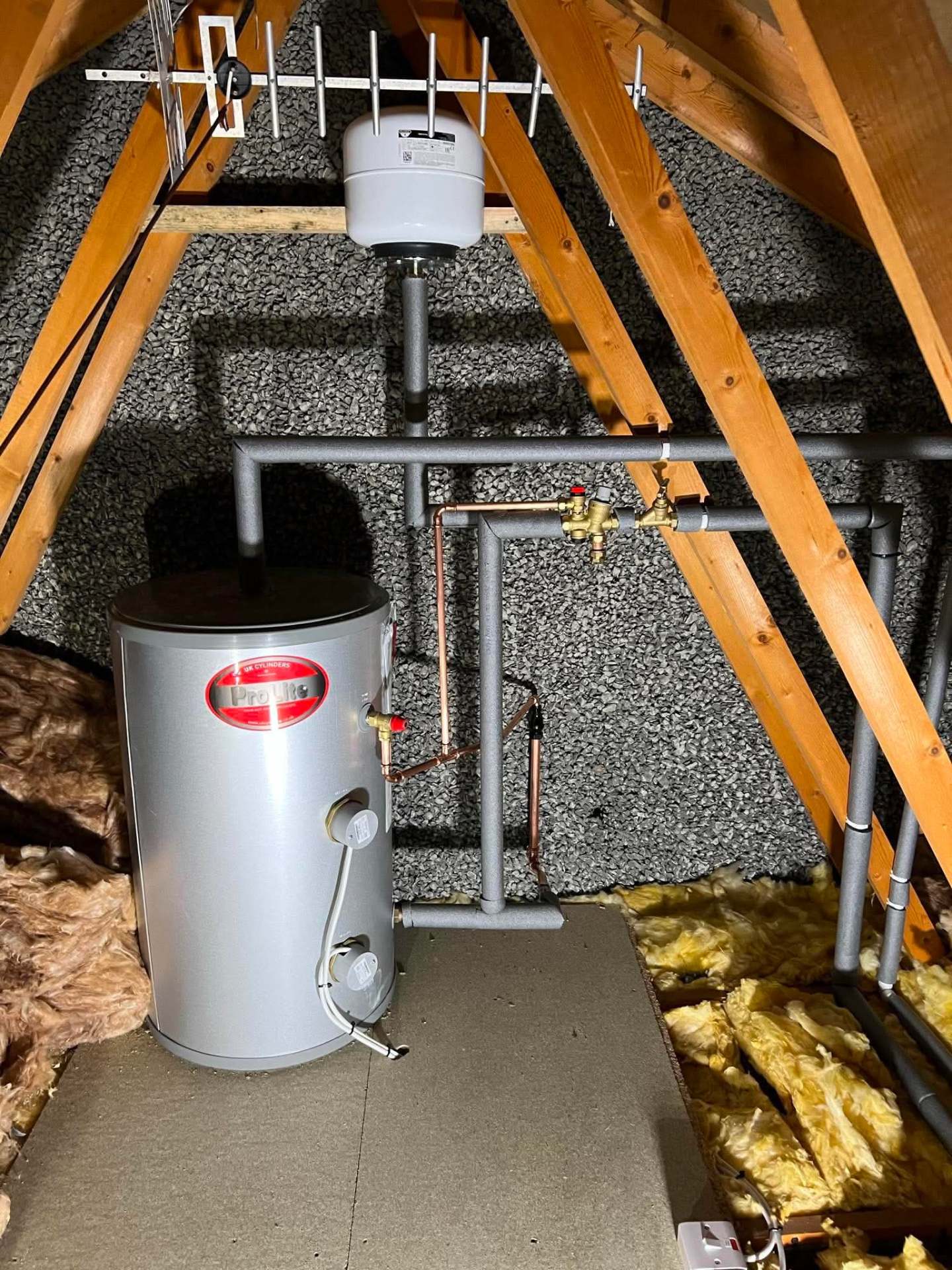 ProLite unvented cylinder installed in a loft with insulated pipework
