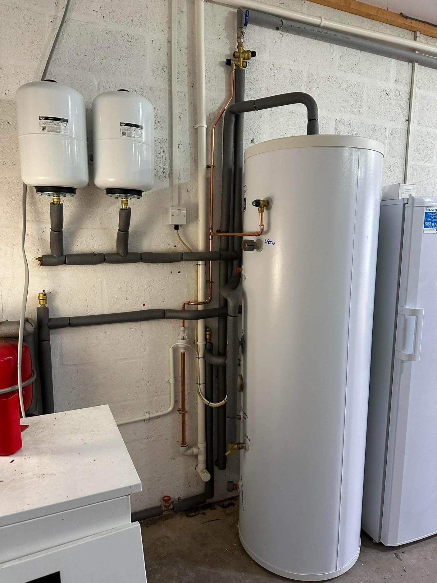 Unvented hot water cylinder installation with expansion vessels
